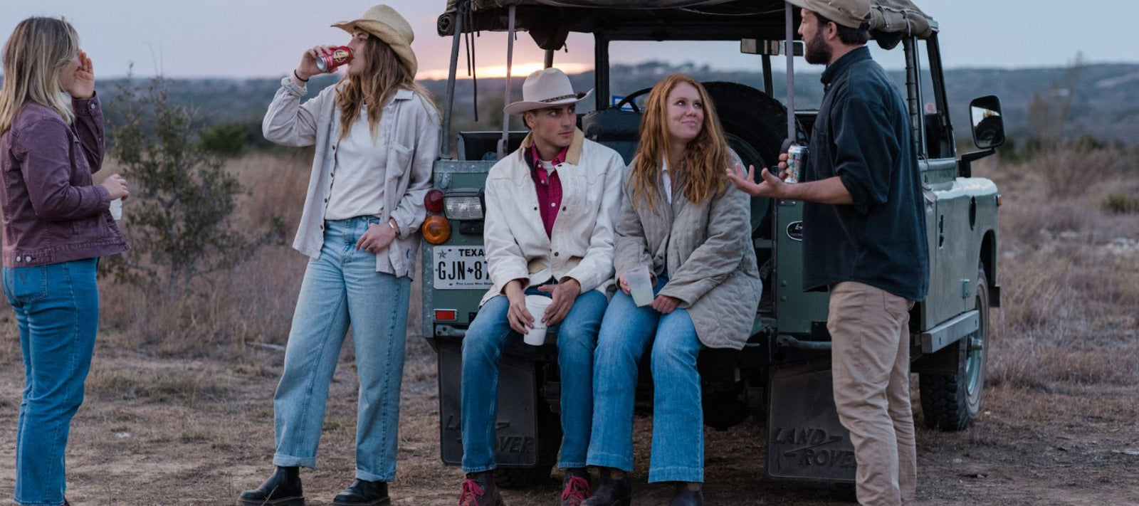 People drinking beer enjoying a Texas sunset